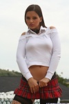 Sweet Eva posing at the pool in schoolgirl skirt